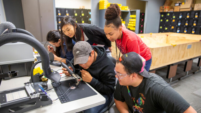 Students participate in a robotics hackathon.