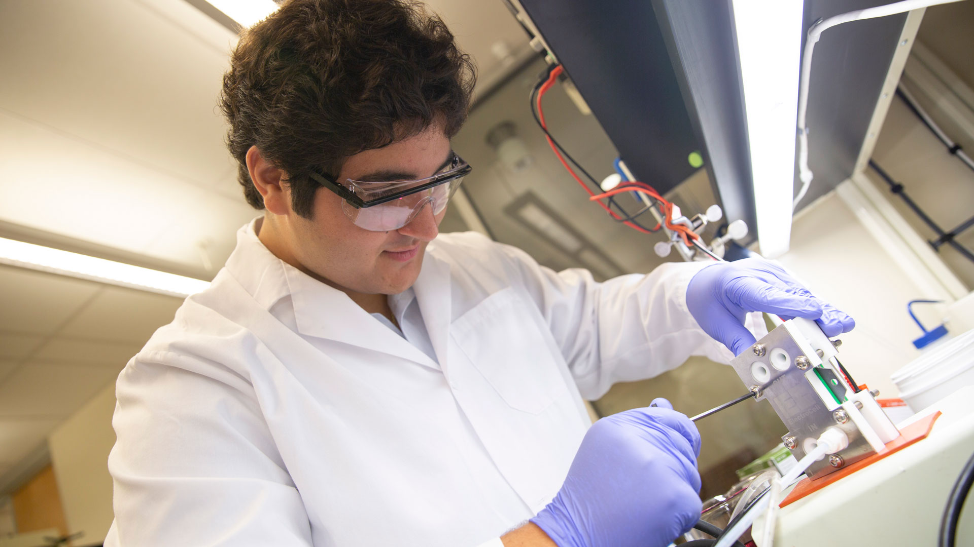 FURI student Dominic Varda works in a lab.
