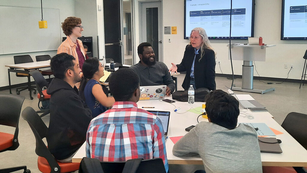 Andrea Cherman, assistant teaching professor in the technological and entrepreneurship management program, offers entrepreneurial guidance to her students in the Social Innovation Startup Lab.