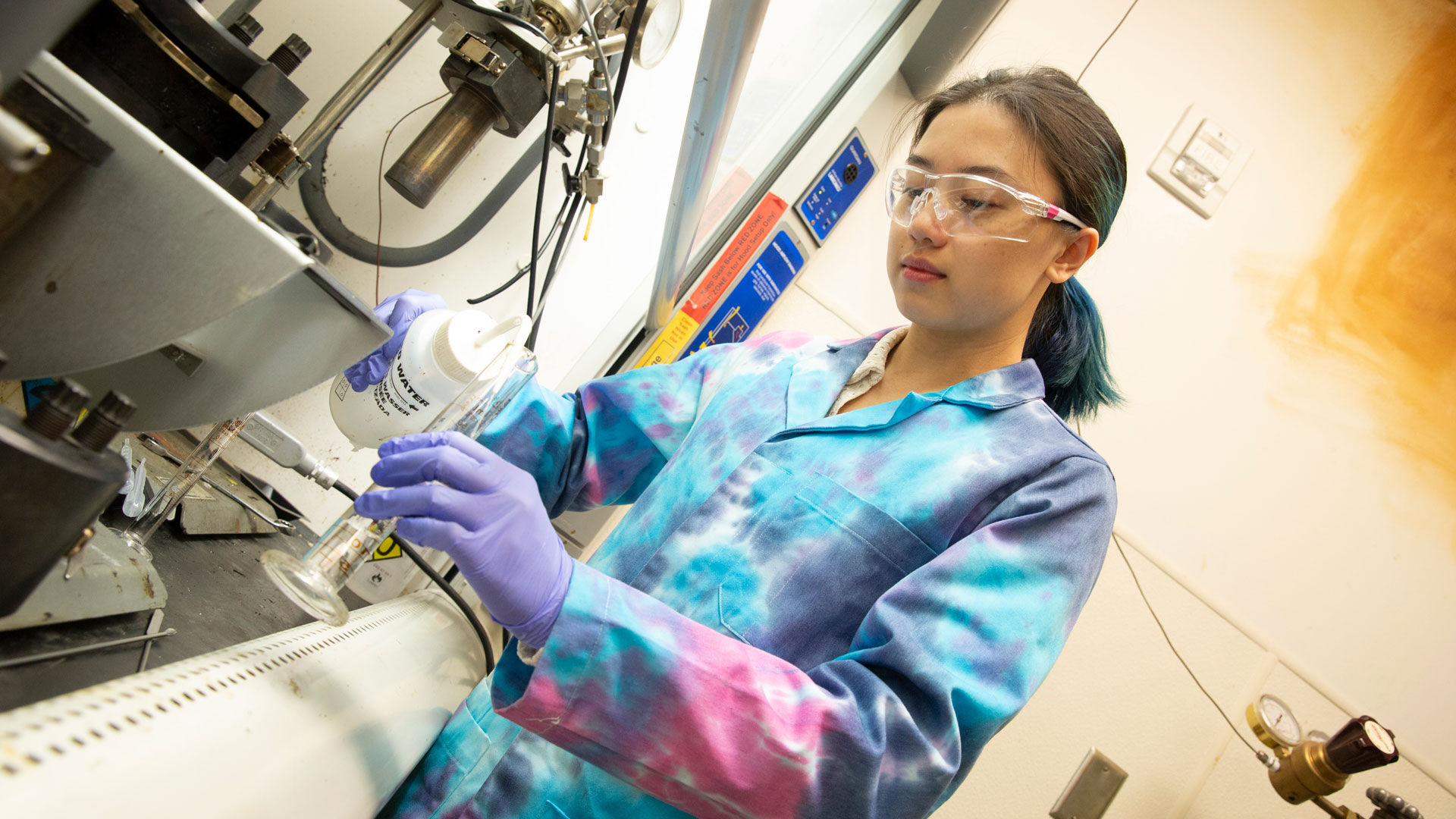 FURI student Kelly Nguyen works on research in a lab.