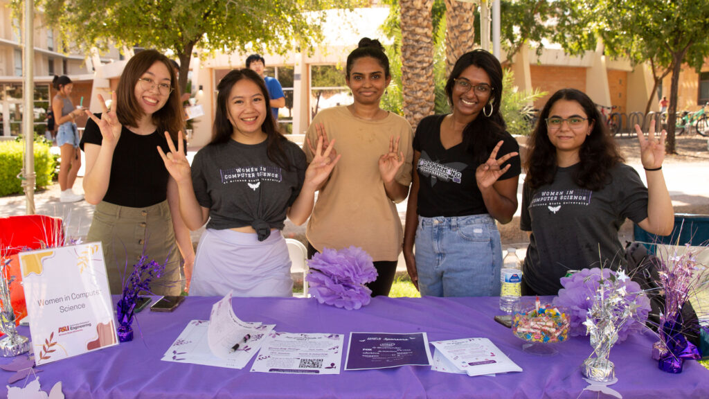 Students from a Fulton Student Organization pose at a new student welcome event.