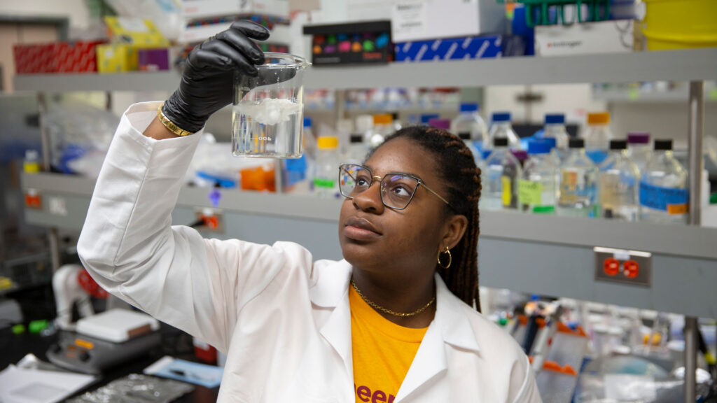 A FURI student conducts research in the lab.