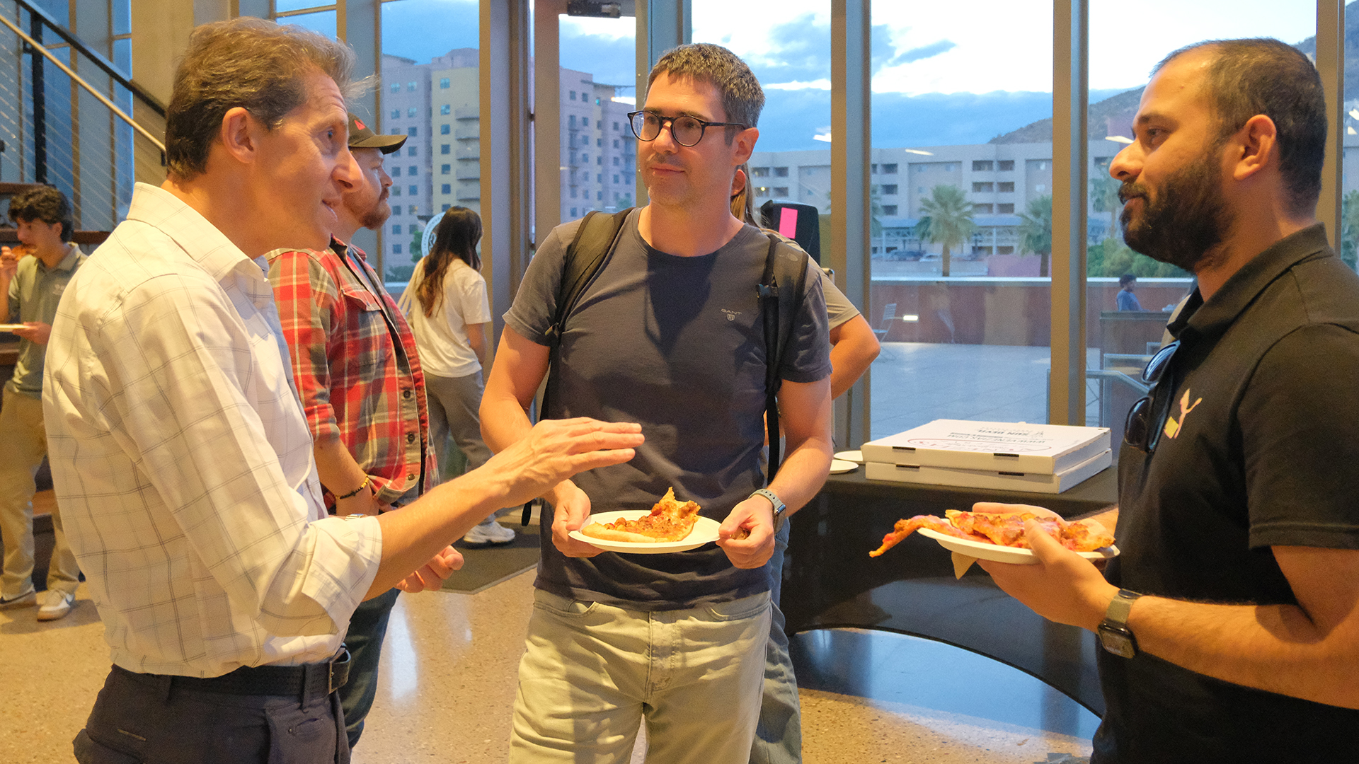 School director meets with students at forum event.